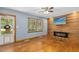 Inviting living room with wood floors, stylish fireplace, and large window at 1139 Princeton Kenly Rd, Kenly, NC 27542