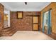 Exposed brick living room with barn door and modern rustic decor at 1139 Princeton Kenly Rd, Kenly, NC 27542