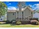 Exterior view of the back of the house showing the deck and well-maintained lawn at 115 E Seve Ct, Morrisville, NC 27560