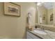 Bathroom featuring a granite vanity, decorative mirror, and stylish decor at 115 E Seve Ct, Morrisville, NC 27560