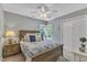 Bright bedroom featuring natural wood furniture, a ceiling fan, and plenty of natural light at 115 E Seve Ct, Morrisville, NC 27560