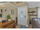 Welcoming entryway featuring a front door, tiled floor, and decorative wooden furniture at 115 E Seve Ct, Morrisville, NC 27560