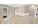 Hallway featuring natural light, neutral paint, and seamless access to adjacent rooms at 115 E Seve Ct, Morrisville, NC 27560