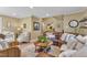 Open-concept living room boasts a stylish area rug, large leather sofa and stairway access at 115 E Seve Ct, Morrisville, NC 27560