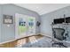 Bright office with French doors, leading to backyard; with sleek desk and chair at 115 E Seve Ct, Morrisville, NC 27560
