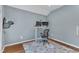 A serene home office featuring modern desk setup, chair, and warm hardwood floors at 115 E Seve Ct, Morrisville, NC 27560
