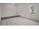 Neutrally decorated bedroom featuring carpeted floors, white walls, and a view from the window at 140 N Keatts Winner Ct, Wilson's Mills, NC 27520
