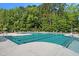 A refreshing community pool surrounded by lounge chairs and lush greenery at 140 N Keatts Winner Ct, Wilson's Mills, NC 27520