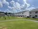 Row of new townhomes with green spaces, offering a modern living experience at 140 N Keatts Winner Ct, Wilson's Mills, NC 27520