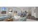 Inviting living space with a soft blue sofa, dining area, and modern kitchen at 140 N Keatts Winner Ct, Wilson's Mills, NC 27520