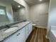 Modern bathroom with double vanity, granite countertop, tub, and a separate shower at 140 Oakfield Trace Dr, Four Oaks, NC 27524