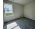 Cozy bedroom featuring plush carpeting and ample natural light at 140 Oakfield Trace Dr, Four Oaks, NC 27524