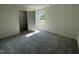 This bedroom has plush carpeting and a closet at 140 Oakfield Trace Dr, Four Oaks, NC 27524