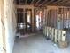 A partially-insulated basement showing the electrical and structural framing under construction at 1413 Malcus Ct # 61, Fuquay Varina, NC 27526