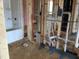View of the home during construction showing stud framing, rough plumbing, and a shower stall at 1413 Malcus Ct # 61, Fuquay Varina, NC 27526