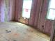 A room being built with pink insulation and two windows at 1413 Malcus Ct # 61, Fuquay Varina, NC 27526