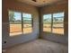 Bedroom featuring drywall and large windows providing natural light, perfect for creating a relaxing atmosphere at 1413 Malcus Ct # 61, Fuquay Varina, NC 27526