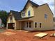A partially-sided two-story home showing framing details and a classic roofline at 1413 Malcus Ct # 61, Fuquay Varina, NC 27526