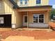Close-up view of a home's front entrance, displaying framing details and windows at 1413 Malcus Ct # 61, Fuquay Varina, NC 27526