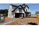Two-story home featuring a modern farmhouse design with white siding and a two-car garage at 1413 Malcus Ct # 61, Fuquay Varina, NC 27526