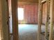View of an interior under construction, showing framing, insulation, and window placement at 1413 Malcus Ct # 61, Fuquay Varina, NC 27526