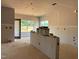 A new home featuring a kitchen with a spacious center island and windows that overlook the backyard at 1413 Malcus Ct # 61, Fuquay Varina, NC 27526