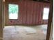 An unfinished room showcasing window framing and pink insulation, ready for design and finishing touches at 1413 Malcus Ct # 61, Fuquay Varina, NC 27526