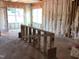 A room under construction with pink insulation and an unfinished counter at 1413 Malcus Ct # 61, Fuquay Varina, NC 27526