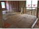 Unfinished living room with large windows and construction elements awaiting personalized touches at 1413 Malcus Ct # 61, Fuquay Varina, NC 27526