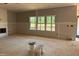 Spacious living room with large windows showcasing a scenic view and filling the space with natural light at 1413 Malcus Ct # 61, Fuquay Varina, NC 27526