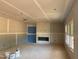 New home interior showcasing a living room with a fireplace, drywall, and ample windows for natural light at 1413 Malcus Ct # 61, Fuquay Varina, NC 27526