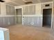 Unfinished living room showcasing drywall with cutouts for outlets and doorways at 1413 Malcus Ct # 61, Fuquay Varina, NC 27526