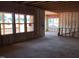 Unfinished living room featuring large windows overlooking the property, awaiting personalized design at 1413 Malcus Ct # 61, Fuquay Varina, NC 27526