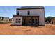 View of rear exterior showcasing a covered porch and large windows, perfect for enjoying the outdoor scenery at 1413 Malcus Ct # 61, Fuquay Varina, NC 27526