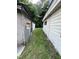 Exterior: Side view of the house shows the proximity of buildings and walkway between them at 1521 Lewis St, Rocky Mount, NC 27804