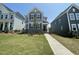 Charming two-story home featuring a stone facade and beautifully landscaped front yard at 1577 Goldfinch Perch Ln, Knightdale, NC 27545