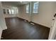 Bright living room featuring hardwood floors, recessed lighting, and large windows at 1577 Goldfinch Perch Ln, Knightdale, NC 27545