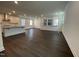 Open-concept living space featuring hardwood floors, recessed lighting, and ample natural light from numerous windows at 1577 Goldfinch Perch Ln, Knightdale, NC 27545