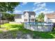 Exterior view of backyard showing above ground pool and fenced yard at 1613 Patterson Grove Rd, Apex, NC 27502
