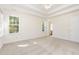 Spacious bedroom with large windows and neutral carpeting at 1613 Patterson Grove Rd, Apex, NC 27502
