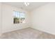 Bright bedroom featuring a neutral carpet, and a window for lots of natural light at 1613 Patterson Grove Rd, Apex, NC 27502