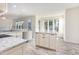 Kitchen with white marble countertops, stainless steel appliances, and a large island at 1613 Patterson Grove Rd, Apex, NC 27502