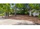 The large shaded backyard is set up for outdoor relaxation and entertaining at 1832 Blandwood Dr, Rocky Mount, NC 27801