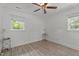 Bedroom with a ceiling fan, two windows and a decorative table at 1832 Blandwood Dr, Rocky Mount, NC 27801