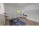 A bright bedroom features two windows with natural light and hard wood flooring and crisp white paint at 1832 Blandwood Dr, Rocky Mount, NC 27801