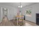 Bright dining area with a wooden table set, hardwood floors, and natural light from the window at 1832 Blandwood Dr, Rocky Mount, NC 27801