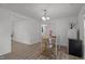Open dining area with hardwood floors, modern lighting, and access to other rooms at 1832 Blandwood Dr, Rocky Mount, NC 27801