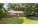 Charming brick ranch with mature trees and a green lawn at 1832 Blandwood Dr, Rocky Mount, NC 27801