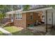 Side view of this brick ranch with an attached carport at 1832 Blandwood Dr, Rocky Mount, NC 27801