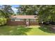 Charming one-story brick house with a manicured lawn and a convenient covered carport at 1832 Blandwood Dr, Rocky Mount, NC 27801
